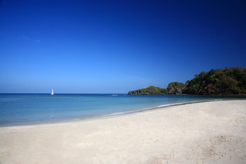 Fototapeta na wymiar White beach at sea coast of Tatutao Island, Andaman sea, Thailan