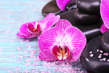 Violet orchid and zen stones close-up