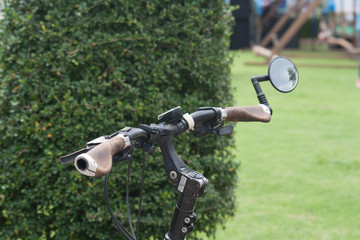 Hand lever straight Mountain bike with mirrors at the ends of the tree. blur.