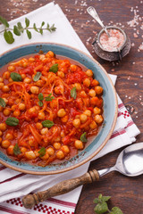  Chickpeas with tomatoes, decorated with mint.selective focus