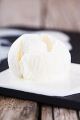 Ice cream, white cream in a white ceramic bowl.selective focus