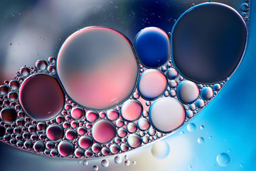 Abstract background with oil drops on water.