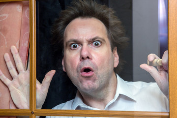 Man watching the situation outside the window