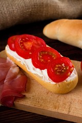 Crispy baguette with cream cheese and tomatoes