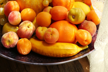 Heap of fresh fruits on tray close up