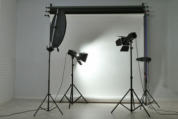 Empty photo studio with lighting equipment