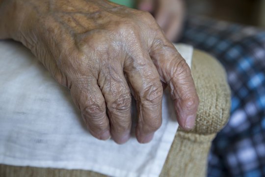 closeup wrinkled hand of a senior person