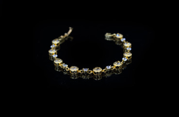 Jewelry accessories - bracelet with sapphire on a black backgrou
