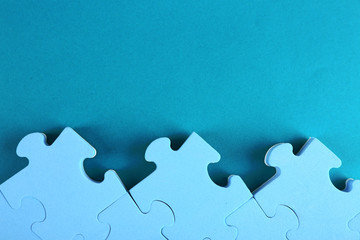 Puzzle pieces on blue background