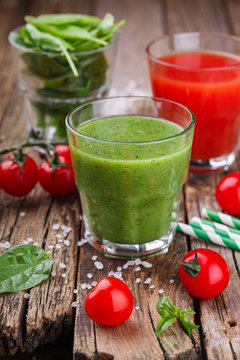 Tomato juice and green smoothies with spinach, kiwi and Apple.selective focus