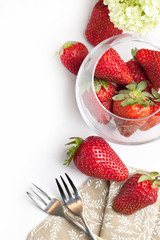 Fresh strawberries over white