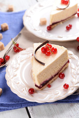 Tasty cheesecake with berries on table close up