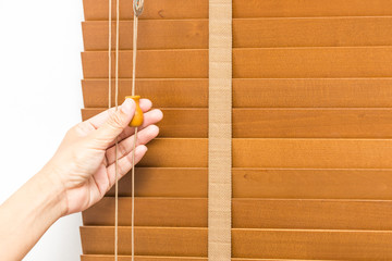 Wood blinds closed by hand.
