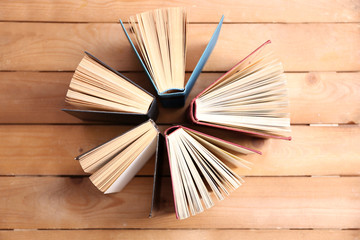 Heart of books, on wooden background