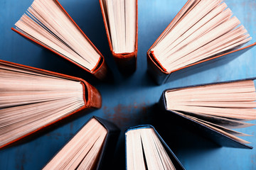 Heart of books, on wooden background