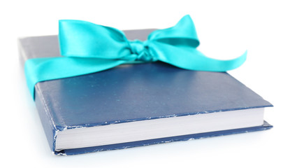 Book wrapped with color ribbon isolated on white