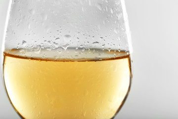 Glass of wine on grey background