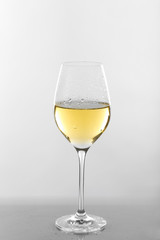 Glass of wine on grey background