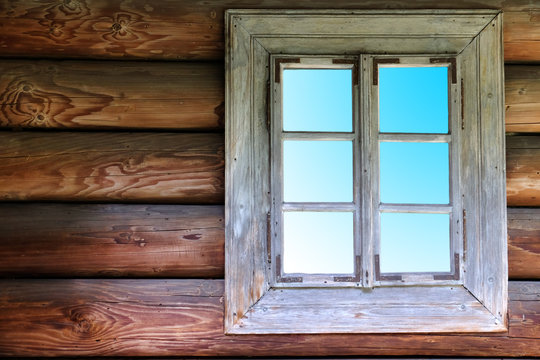 Wooden wall with old window