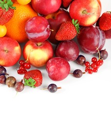 Heap of fresh fruits and berries  isolated on white