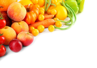 Heap of fresh fruits and vegetables  isolated on white