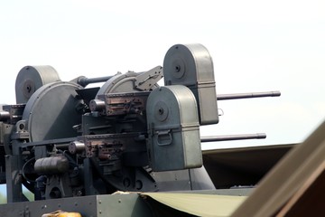 military truck with a deadly machine gun on the roof