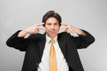 Portrait of man closed one eye with his hand