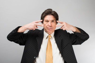 Portrait of man closed one eye with his hand