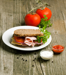 Plate with sandwich and tow kind of sauces