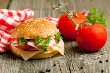 Fresh sandwich with ham and tomato