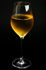 Glass of wine on dark background