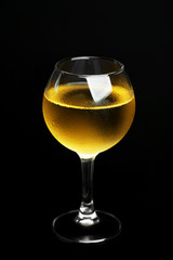 Glass of wine on dark background