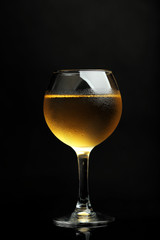 Glass of wine on dark background