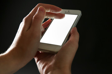 Finger touch number on smartphone to make a call on black background