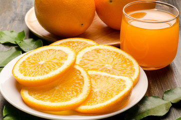 Navel orange fruit and juice on wooden background,healthy food