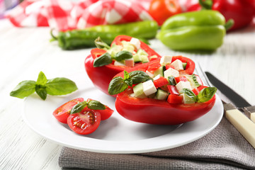 Fresh green salad in pepper on table close up