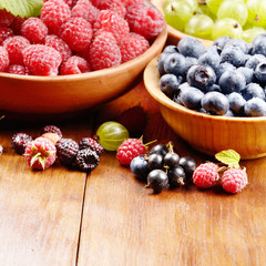 Wooden bowls with organic berries