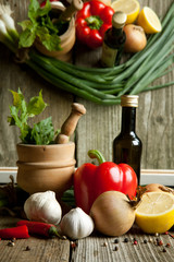 Vintage mortar and mix of vegetables with reflex