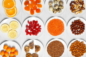 Set of orange products on wooden table, closeup