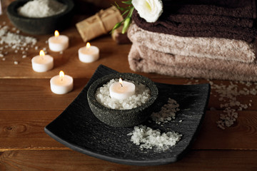 Fototapeta na wymiar Beautiful spa composition with candles on wooden background