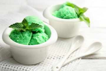 Homemade mint ice-cream on light wooden background