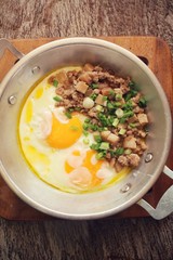 Breakfast with fried eggs on pan