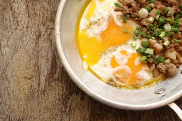 Breakfast with fried eggs on pan