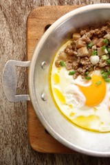 Breakfast with fried eggs on pan