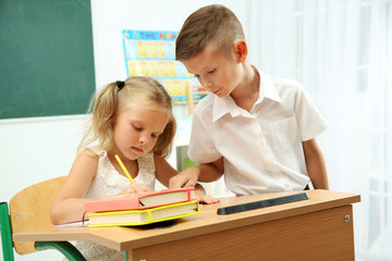 Portrait of happy pupils at lesson