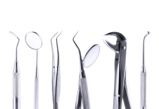 Set of metal medical equipment tools for teeth dental care isolated on white, with clipping path