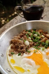 Breakfast with  fried eggs on pan and hot coffee