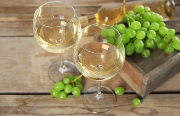 Still life of wine and bread on light background