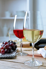 Still life of wine and bread on light background