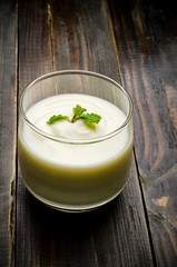 Homemade yogurt in the glass on wooden background,healthy food